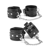 Faux crocodile leather wrist and ankle cuffs with metal chains from the Temptation 8 Pieces Bondage Kit