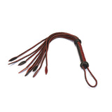 Luxurious wine red leather cat o' nine tails whip with braided handle for bondage play