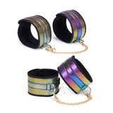 Multicolor holographic soft bondage wrist and ankle cuffs with rose gold chains, part of the Vivid Niji Glossy Bondage Kit