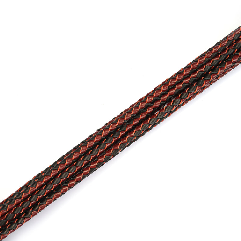 Close-up of wine red and black braided leather for a luxury leather flogger, part of the Wine Red collection