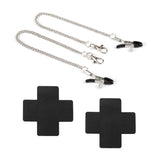 Adjustable black nipple clamps with cross-shaped pasties and silver chain for sensual play, part of Bound You beginner's bondage kit.