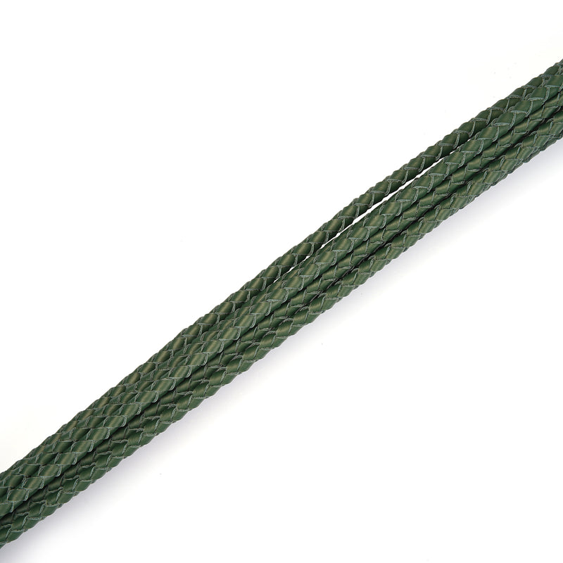 Dark green leather Cat O Nine Tails whip close-up showing detailed braiding
