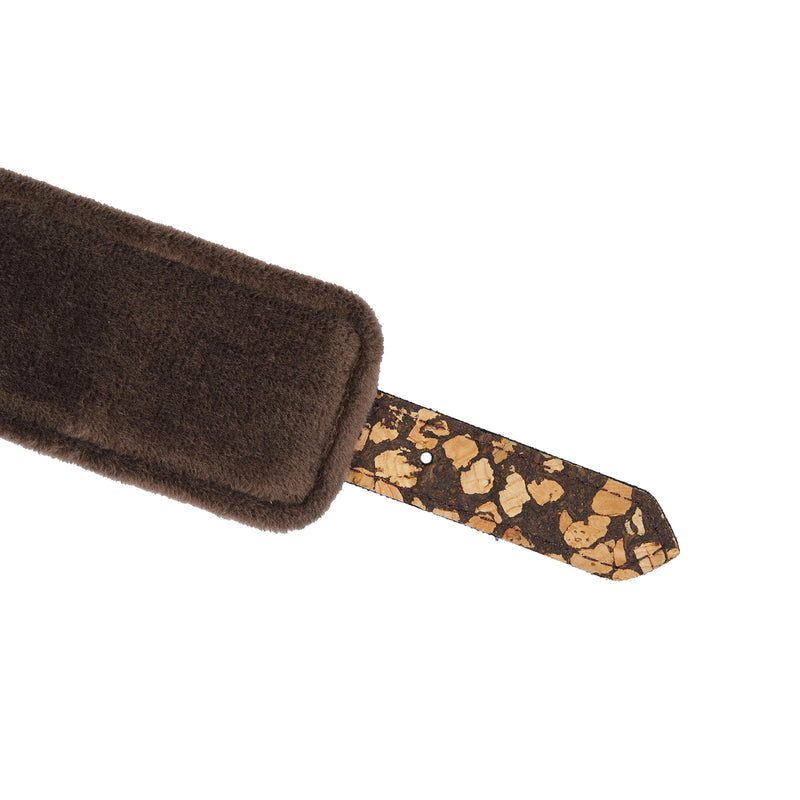 Close-up view of vegan fetish SM Cafe handcuff strap made from eco-friendly cork and coffee grounds, highlighted with plush brown velvet lining