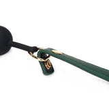 Mossy chic silicone ball gag with adjustable green leather straps and gold metal buckles for BDSM play