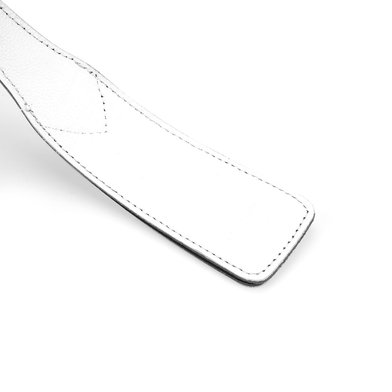 Close-up of Fuji White leather spanking paddle, highlighting dual-layered construction and detailed stitching for BDSM play