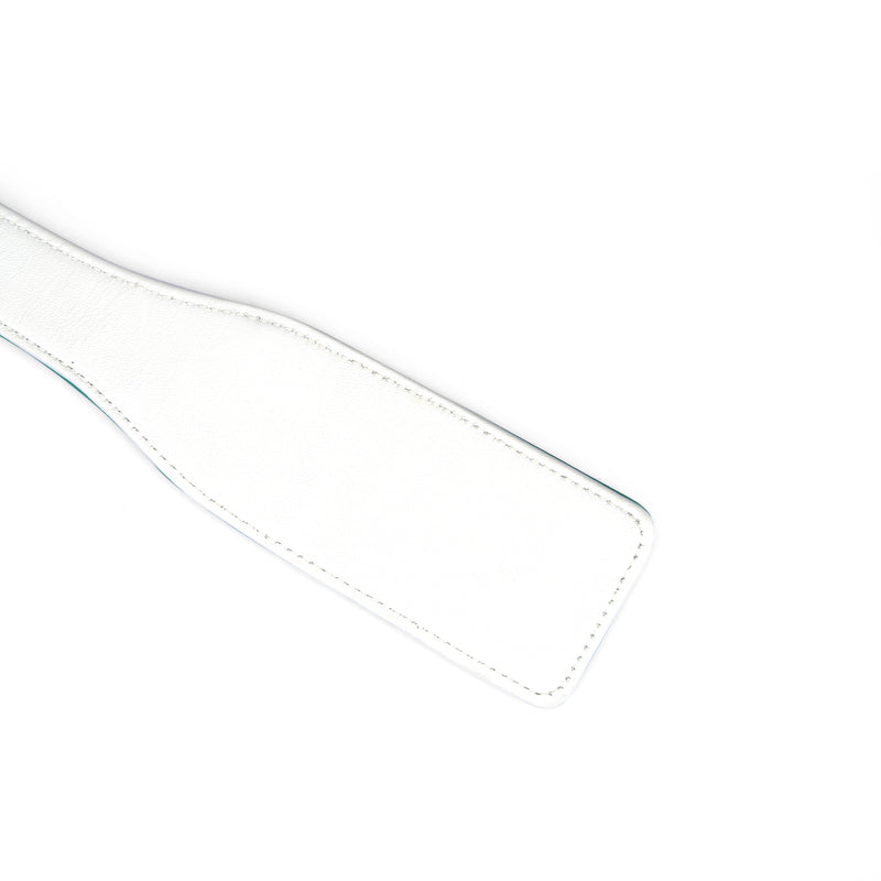 White and green leather spanking paddle from the Fairy collection, designed for bondage play