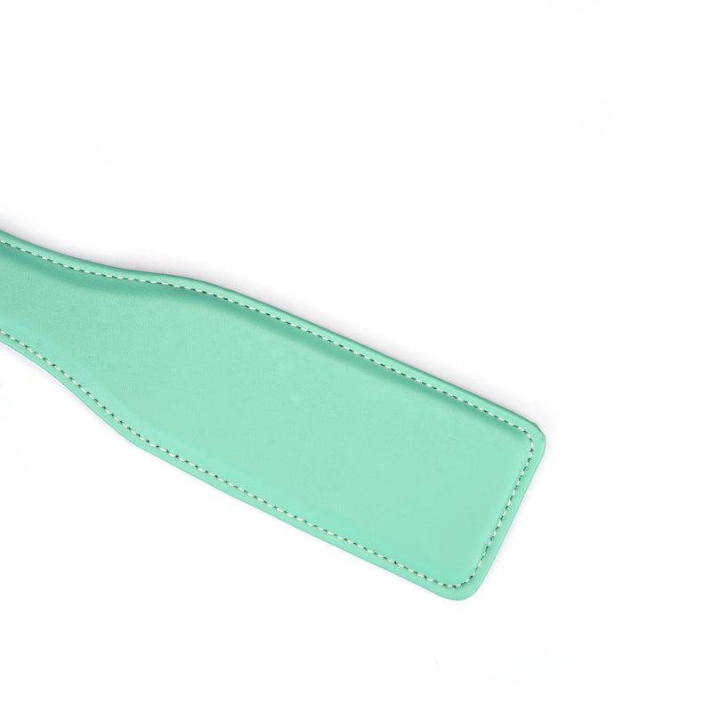 Green leather spanking paddle from LIEBE SEELE's Fairy collection, designed for bondage play, with detailed stitching and a smooth finish