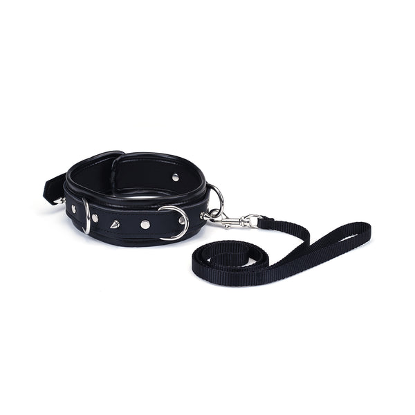 Vegan leather bondage collar with silver studded design and attached black nylon leash for ethical restraint play
