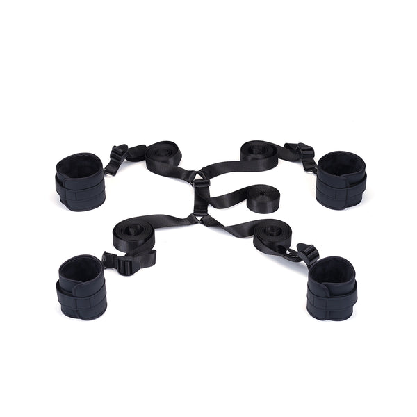 Vegan leather under-mattress restraint set featuring adjustable wrist and ankle cuffs in black for bondage beginners