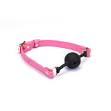 Italian Leather Breathable Ball Gag in Pink with black silicone ball, adjustable and fashionable for bondage play