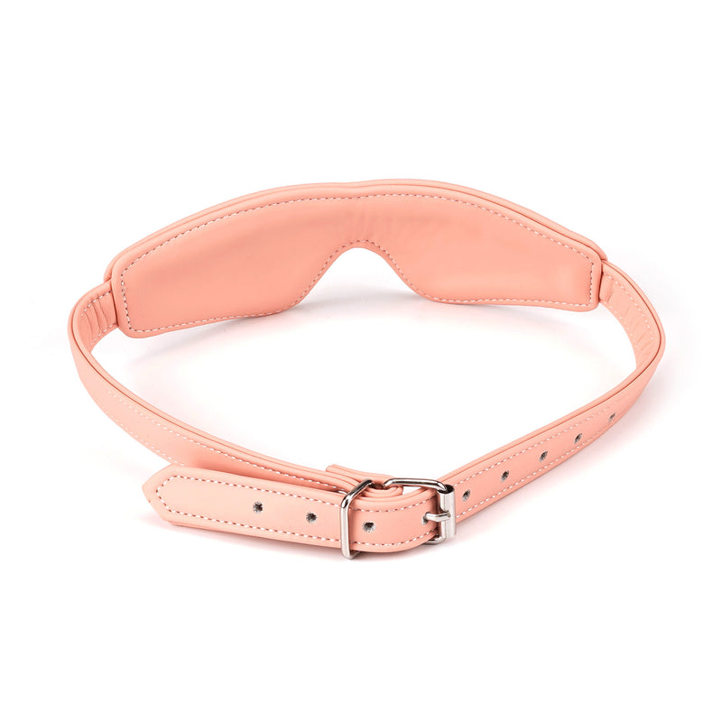 Pink vegan leather blindfold with golden buckle from Dark Candy collection, ideal for sensory deprivation and bondage play