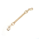 Gold quick-release clip with chain for bondage restraints, compatible with Mossy Chic Leather Wrist Cuffs