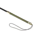 Luxury green leather riding crop with gemstone embellishments and gold metal accents, designed for erotic bondage play