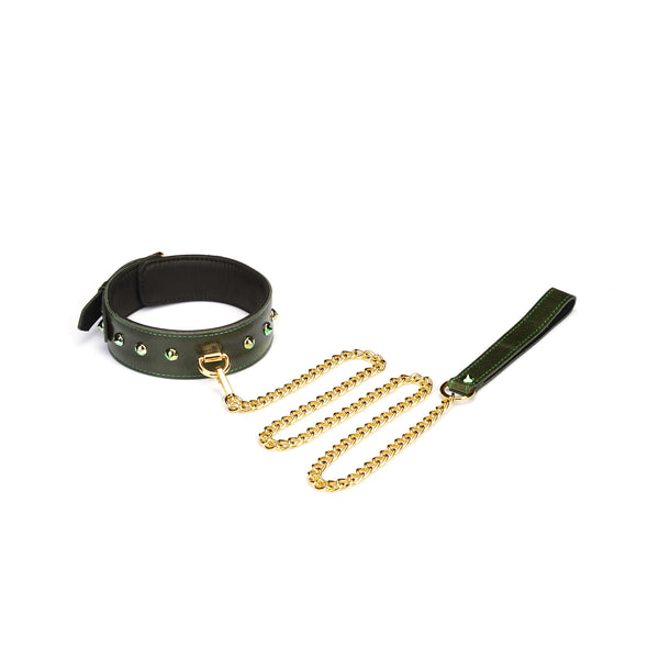 Luxury green leather collar with gemstones and D-ring, paired with gold chain leash for bondage play