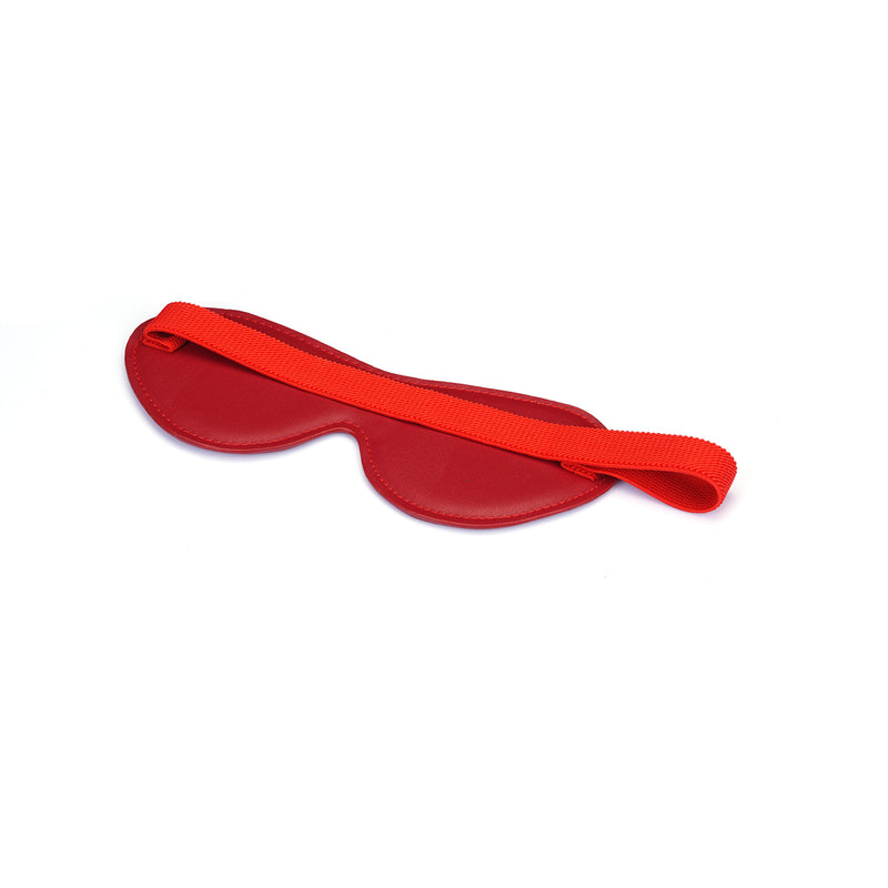 Faux leather red blindfold with contoured design and elastic strap, ideal for enhancing sensory play