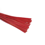 Red faux leather flogger with multiple strands spread out, essential for passionate and energetic bondage play