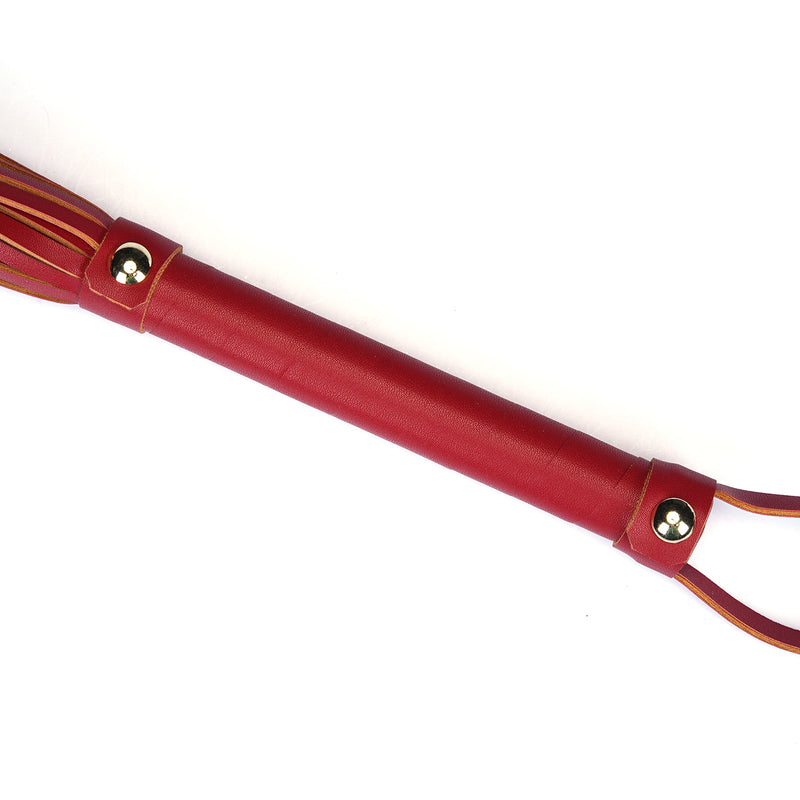 Red faux leather flogger with metallic rivets for bondage play, item FG-80865RD