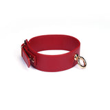 Red faux leather adjustable collar with gold metal ring, perfect for bondage play