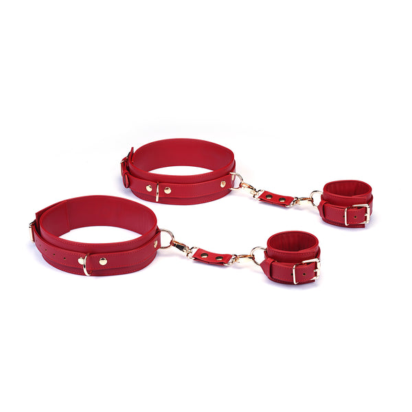 Red faux leather wrist to thigh cuffs kit with adjustable metal buckles for bondage play