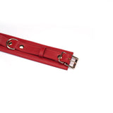 Red faux leather adjustable wrist to thigh cuffs kit with metal buckle, ideal for bondage play
