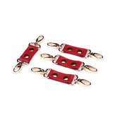 Red faux leather hog ties with metal clips for bondage play, product number HT-80868RD
