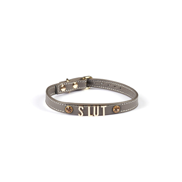 Grey Italian leather choker with gold 'SLUT' lettering and gemstones, adjustable buckle