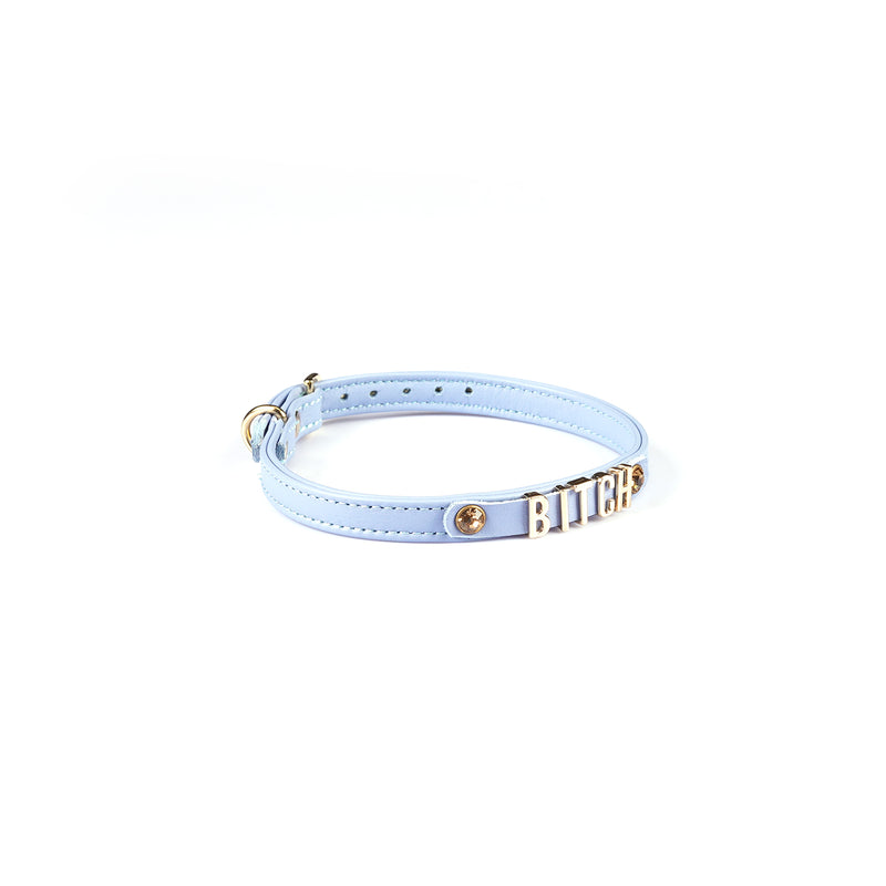 Light blue Italian leather choker with gold letters spelling BITCH and gemstone detail on white background