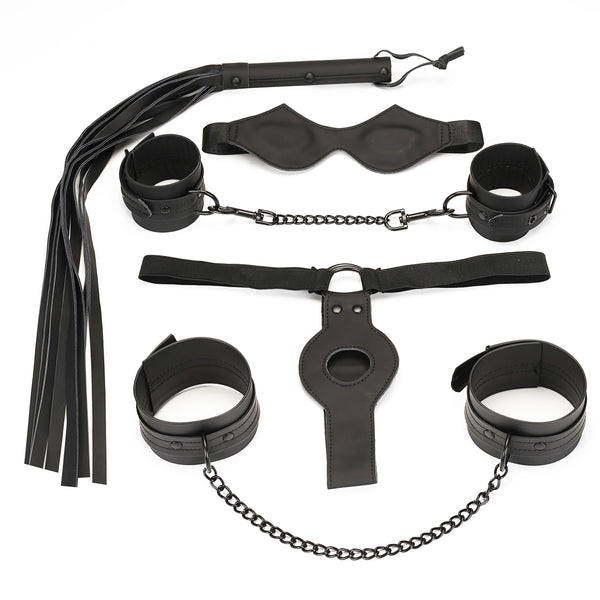 Vegan leather 5-piece bondage set including blindfold, wrist cuffs, ankle cuffs, flogger, and strap-on in black, perfect for beginners exploring bondage pleasure