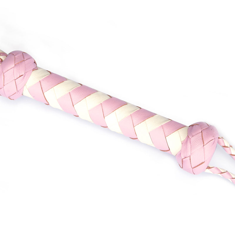 Close-up of white and pink braided leather handle of Fairy collection flogger whip, illustrating premium build and feminine aesthetic