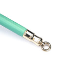 Green leather-coated spreader bar with rose gold metallic accents from the Fairy BDSM collection