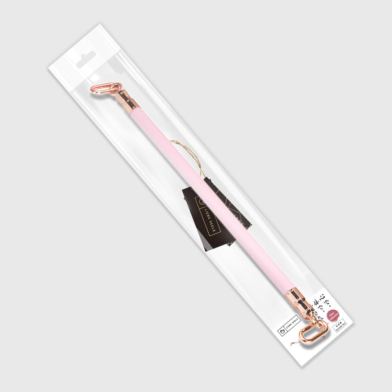 LIEBE SEELE Fairy collection pink leather-coated spreader bar with rose gold metal accents, showcased in transparent packaging