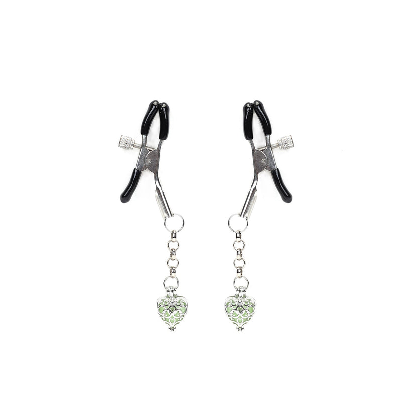Glowing heart-shaped stone nipple clamps with black rubber tips and shimmering chain details, adjustable and comfortable for various experience levels