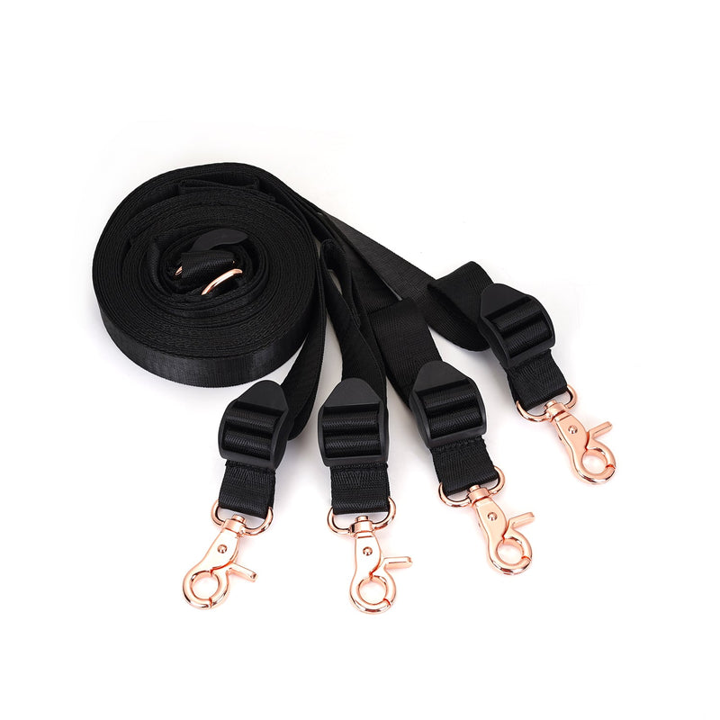 Under Mattress Restraint System with adjustable black webbing belts and rose gold clips for bedroom bondage play