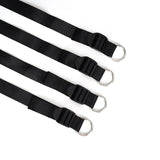 Under mattress restraint system with black adjustable webbing belts and metal D-rings