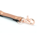 Rose gold leather hogtie clip with quick-release swivel lobster clasp, part of luxury bondage gear collection
