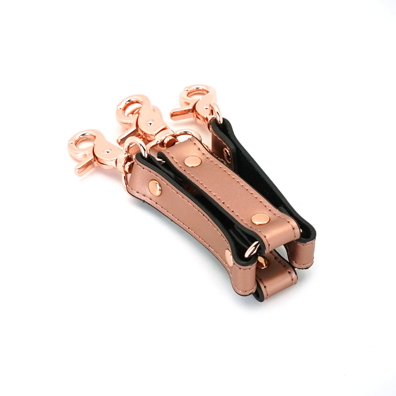 Rose gold leather hogtie from Rose Gold Memory collection with black velvet lining and quick-release clips for bondage play