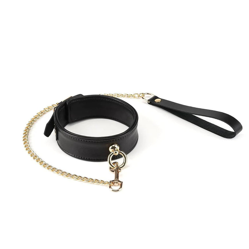 Premium black sheepskin leather bondage collar with gold chain leash and soft inner lining for erotic fixation