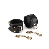 Premium black sheepskin leather wrist cuffs with soft lining and gold hardware, including buckles, D-rings, and metal clips for BDSM play