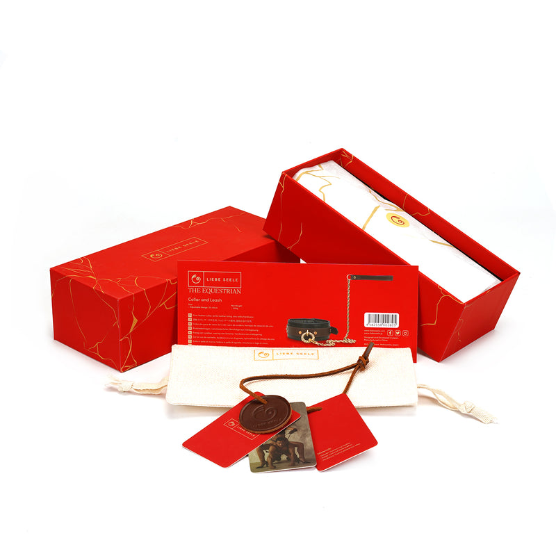 Packaging of The Equestrian collection by LIEBE SEELE, featuring red boxes with gold detailing and product tags visible