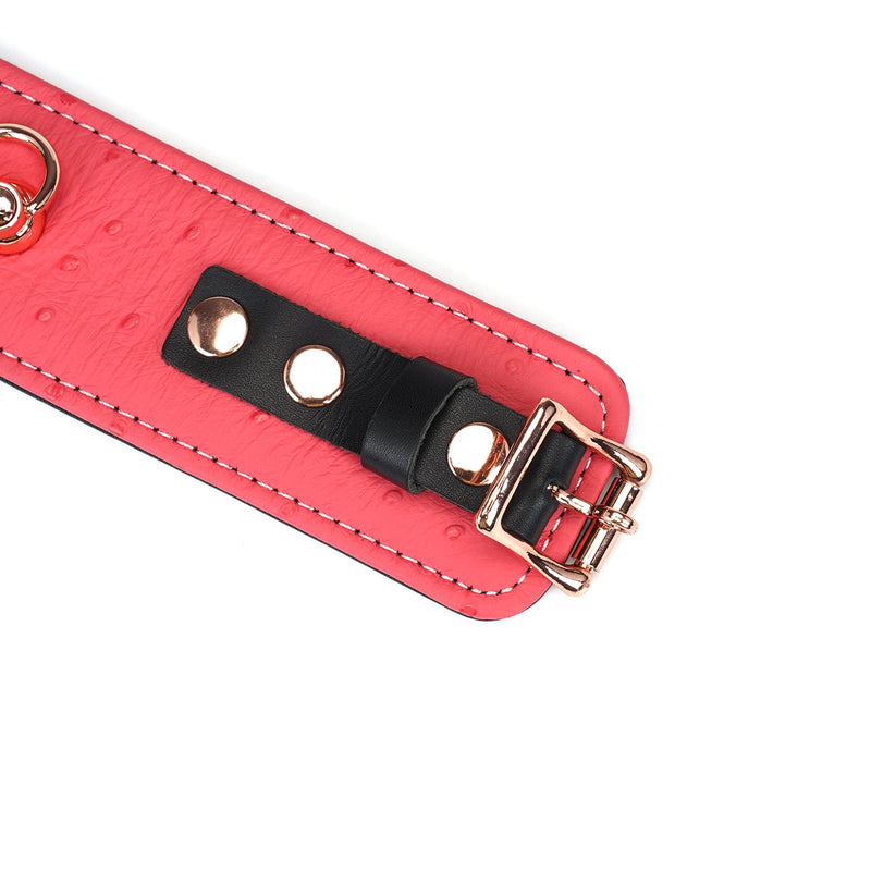 Cherry blossom pink leather handcuff with ostrich skin pattern and rose gold buckle from Angel's & Demon's Kiss collection