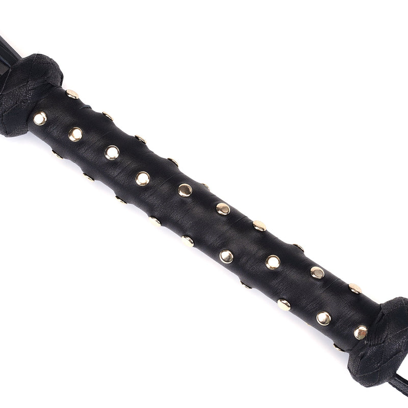 Close-up view of heavy leather flogger with studded handle from the Dark Secret BDSM collection, showcasing high-quality craftsmanship and elegant design