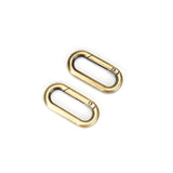 Golden metal quick-release clips for bondage accessories, compatible with various restraints