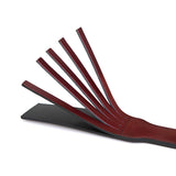 Wine Red dual sensation leather spanking paddle with split and smooth sides for diverse impact play in bondage kit