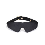 Black leather blindfold with ostrich skin pattern and adjustable rose gold buckle for bondage play