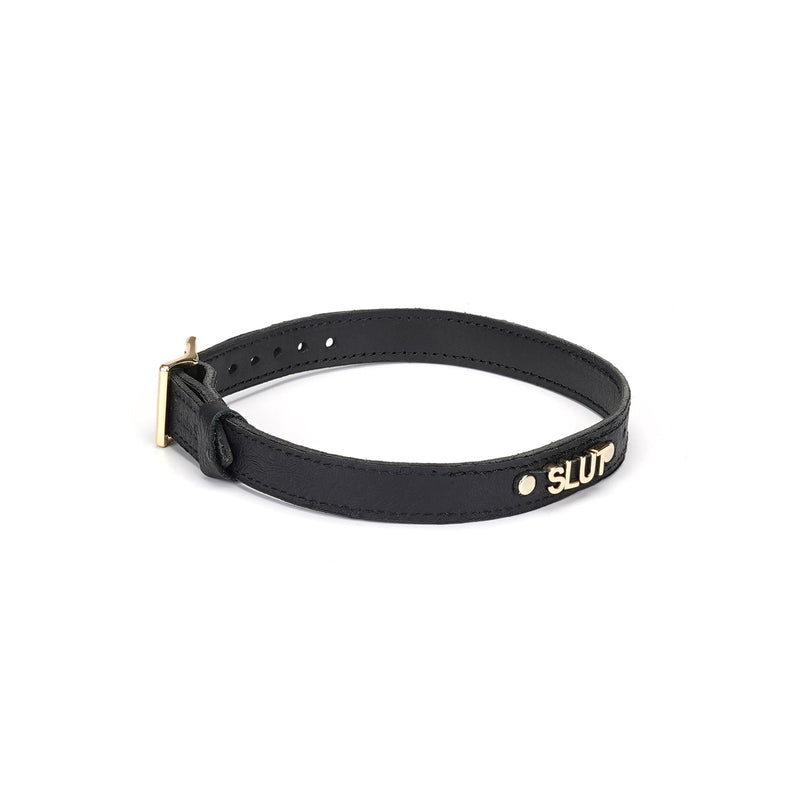 Luxurious black leather 'SLUT' choker with gold letters and ostrich skin pattern from Angel’s & Demon’s Kiss collection
