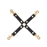 Black leather hog tie with ostrich skin pattern and gold hardware from the Demon's Kiss collection, designed for BDSM restraint play