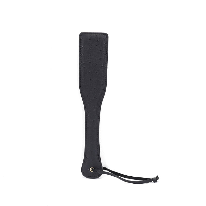 Black leather spanking paddle with ostrich skin pattern from Demon's Kiss collection for BDSM play