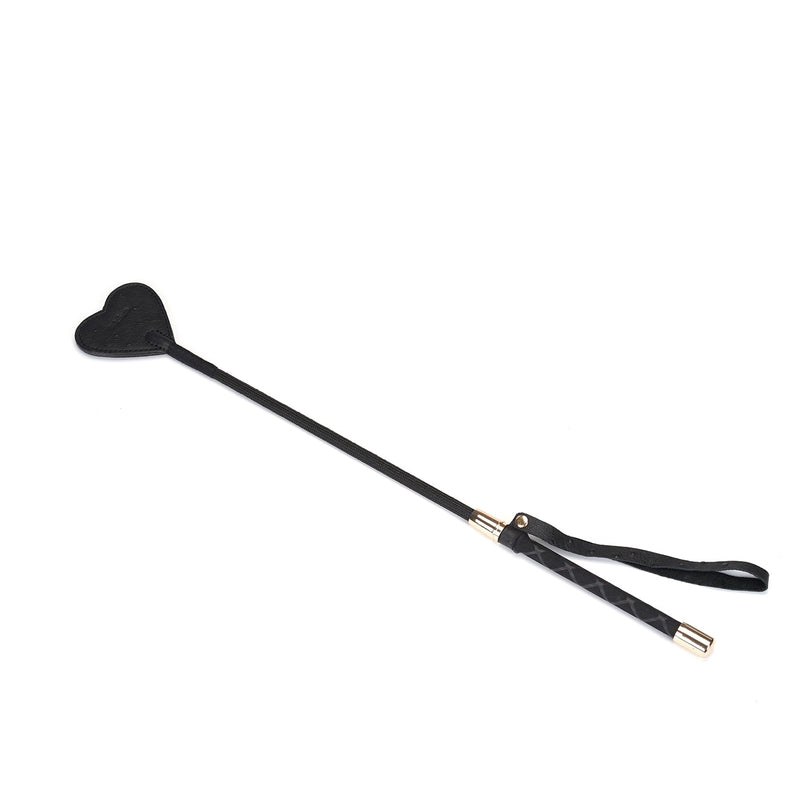Black leather riding crop with heart-shaped tip and wrist loop for BDSM play, part of the Angel's & Demon's Kiss collection