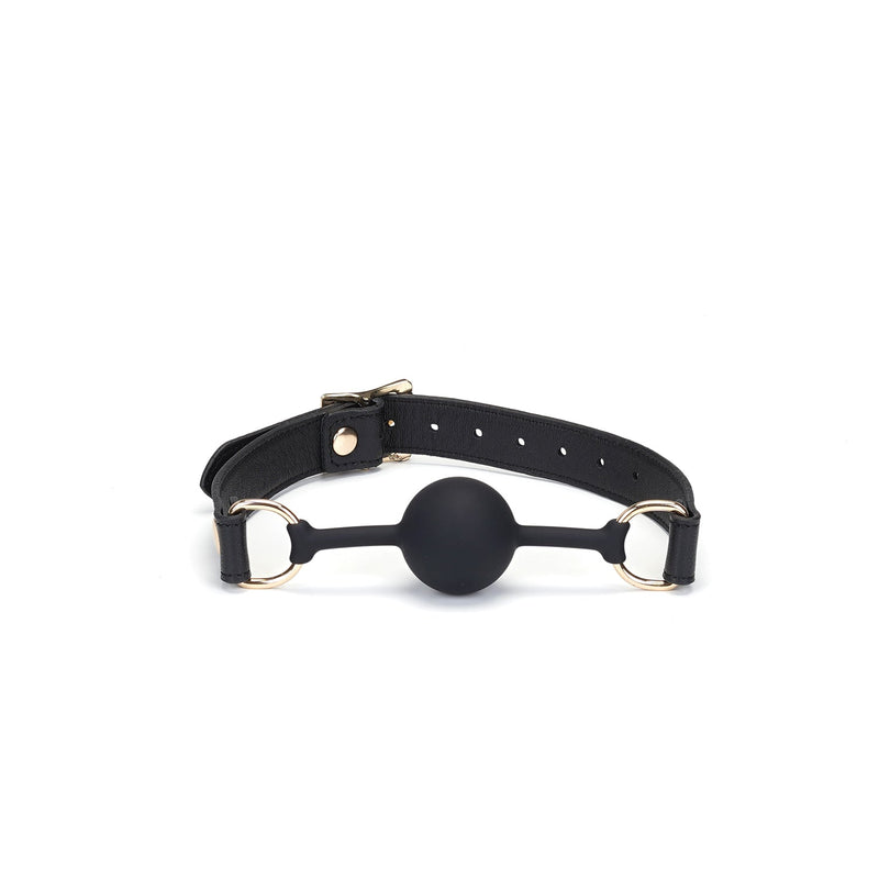 Dark Secret silicone ball gag with black leather straps and golden buckles, an adjustable luxury bondage accessory