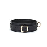 Black leather bondage collar with gold metal buckle and D-ring from the Dark Secret collection, ideal for BDSM and restraint play
